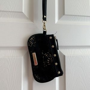 Betsy Johnson wristlet with black and gold lazercut roses